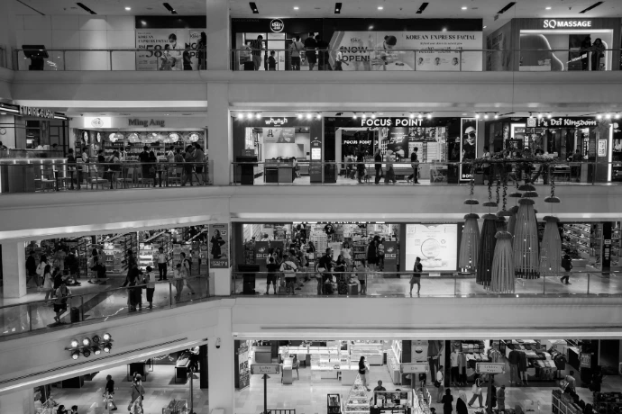 a blaretail and e-commerceck and white photo of a shopping mall